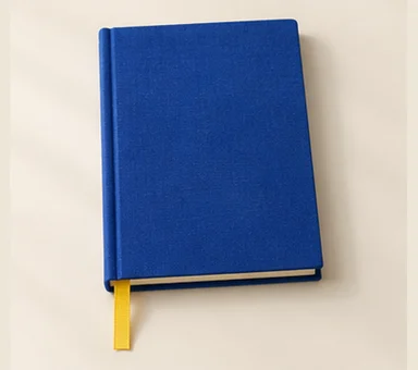 Cobalt blue hardcover journal with a yellow ribbon marker