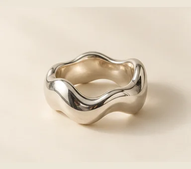 Silver-tone ring with an undulating wavy band